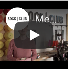 Model wearing Custom cotton socks in crew length with logos for Slack