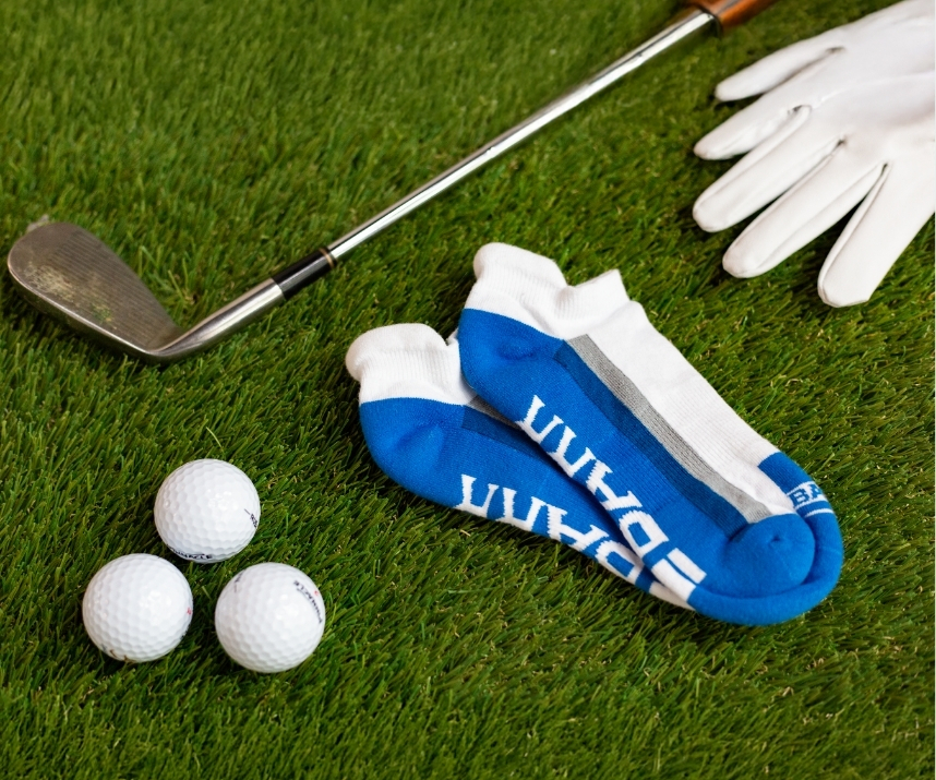 Custom branded ankle socks on a golf course