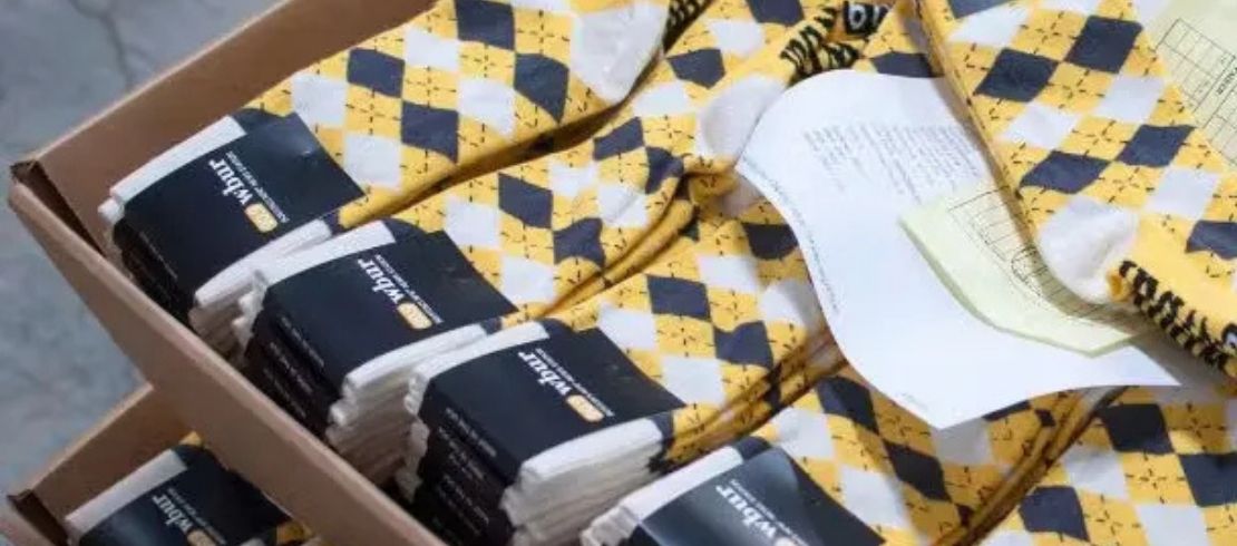 Large high-quantity custom sock order packed in cartons