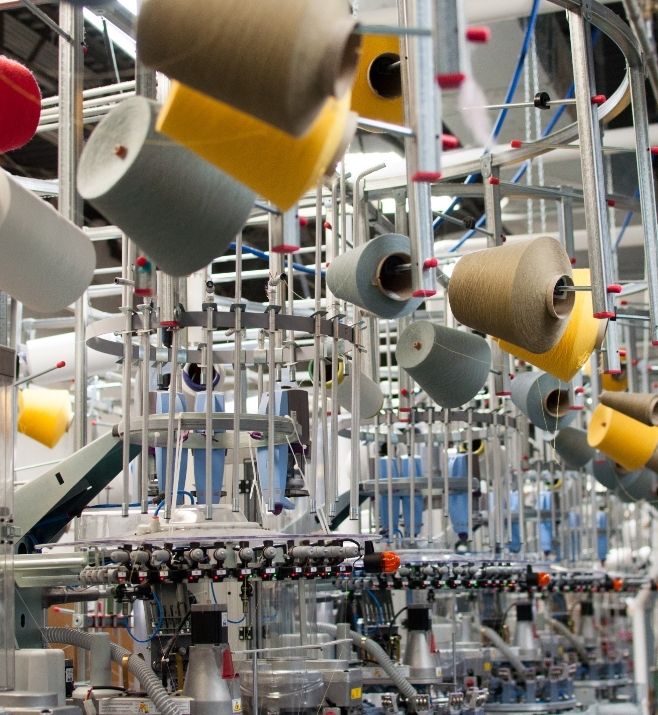 Yarn feeding knitting machines at a Sock Club production facility