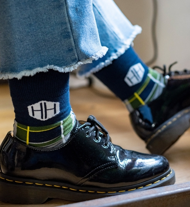 Custom branded socks worn with black shoes