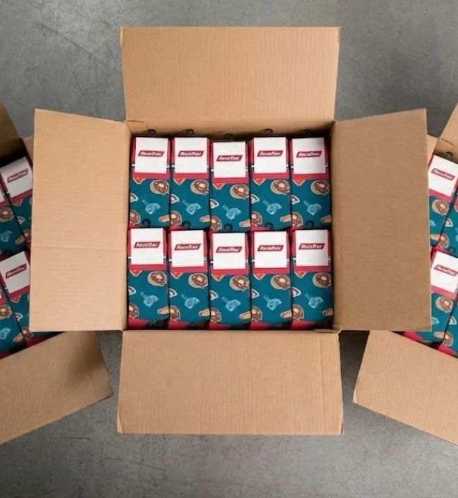 Cartons filled with packaged custom RaceTrac socks