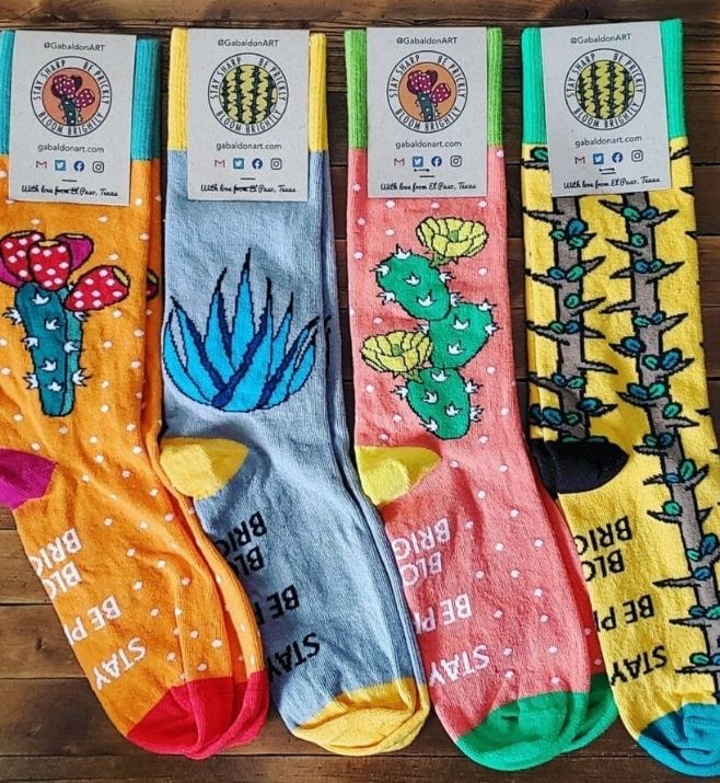 Four colorful custom sock designs with cactus and botanical patterns