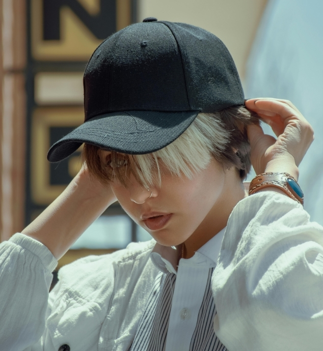 Conference attendee wearing a simple black cap