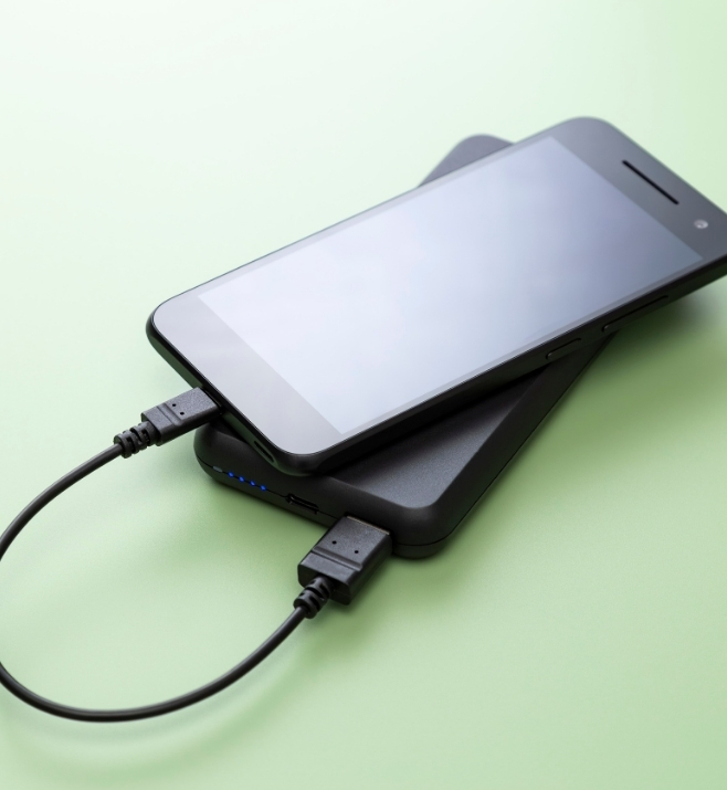 Smartphone connected to a compact portable charger