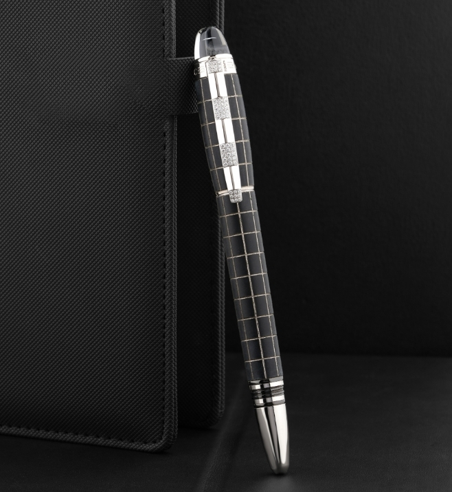 Quality black and silver pen paired with a notebook