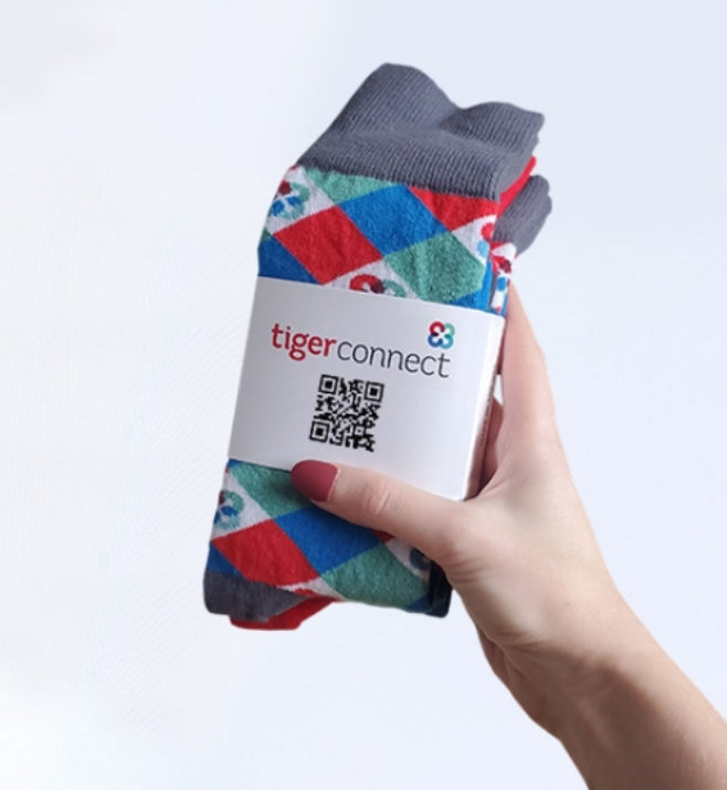 Custom conference socks wrapped with branded QR code packaging