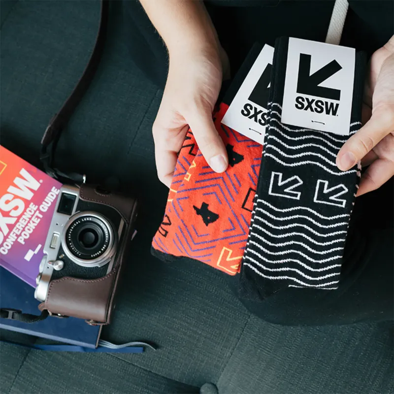 Custom Event Socks group display showing multiple pairs of custom branded socks