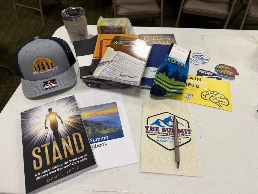 Custom Passion Tree retreat socks displayed with event materials
